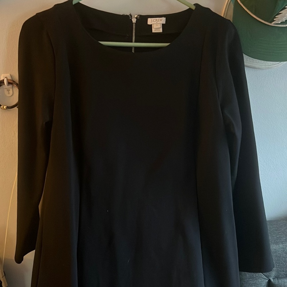 J Crew woman’s black dress with 3/4 inch sleeves. In excellent used condition.